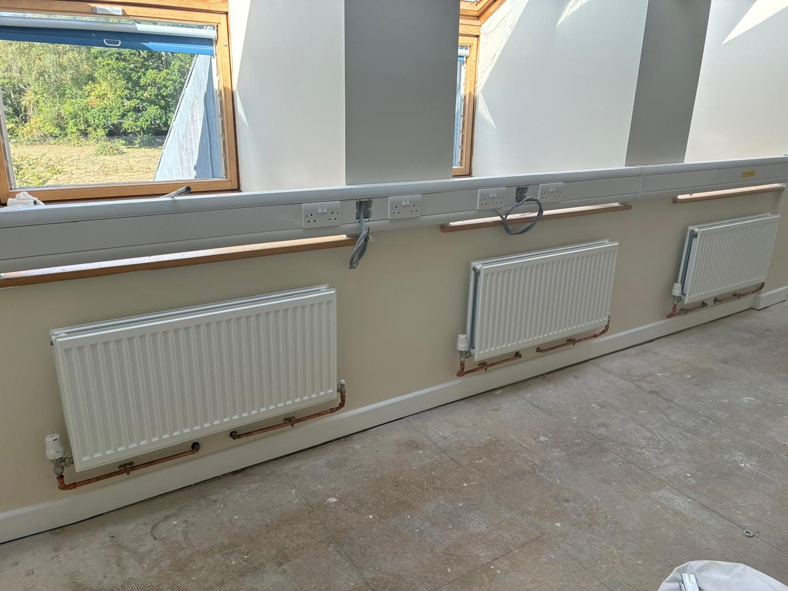 New radiators along a corridor at Ashurst Hospital