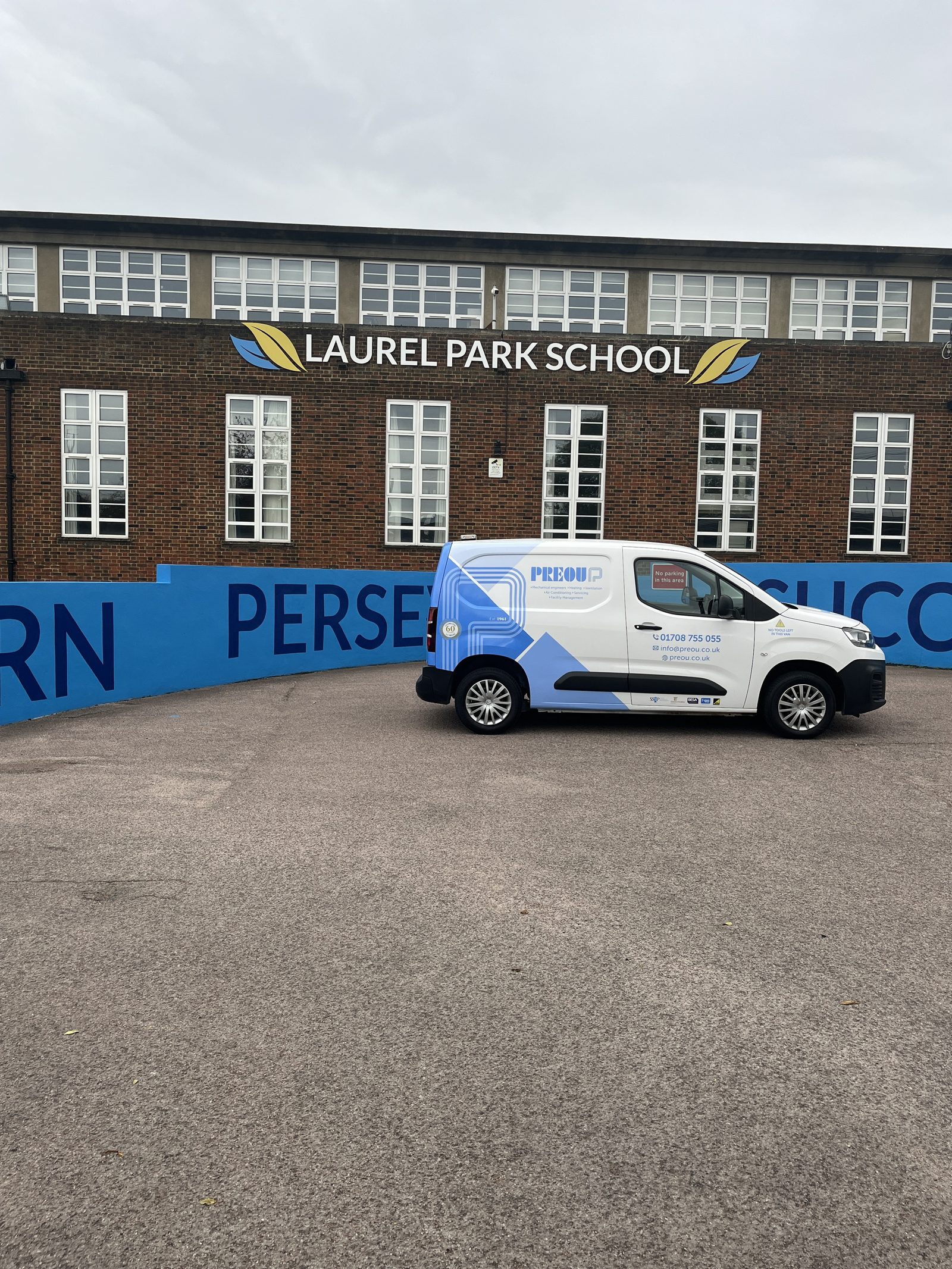 A Preou van outside Laurel Park School