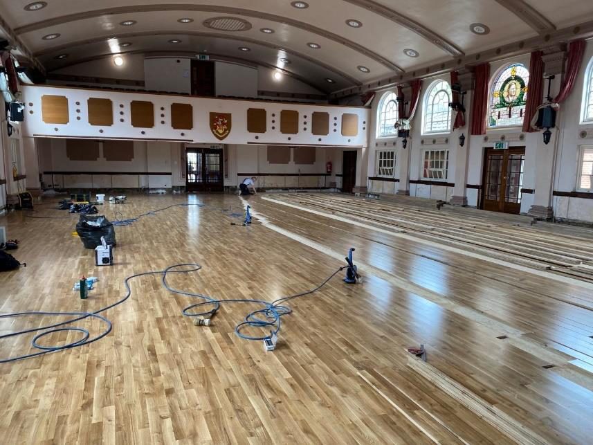 The main hall at Westcliff High School for Boys during refurbishment of the parquet floor