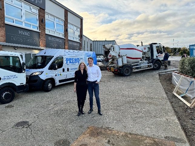 Two of the team beside Preou vans at Radford Crescent during the renovation